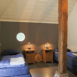 Cozy bedroom in vacation home in Orvelte, Central Drenthe, with rustic details.