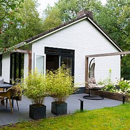 Terrace of cottage in Gasselte with modern seating area, located in green Drenthe.