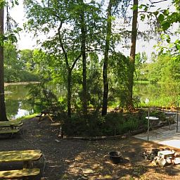 Enjoy the serenity of nature at Cottage in Papenvoort, a vacation home in Central Drenthe, overlooking a beautiful forest lake.