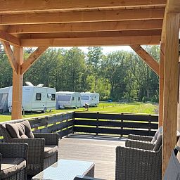 Cozy sitting area on the porch of Holiday Home in Eeserveen, Drenthe.