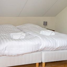 Gemuetliches Schlafzimmer im Ferienhaus "Huisje in Een" in Nord-Drenthe mit bequemen Betten und ruhiger Atmosphaere fuer einen entspannten Aufenthalt.