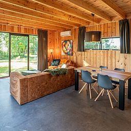 Dining and sitting area in Holiday home in Dalerveen, Southeast Drenthe, perfect for family gatherings.