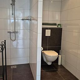 Modern bathroom in Holiday Home in Dalerveen, Southeast Drenthe, with spacious shower and stylish tiles for a comfortable stay.