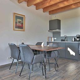 View of green fields surrounding DG1415, vacation home in Zuidwolde, Drenthe.