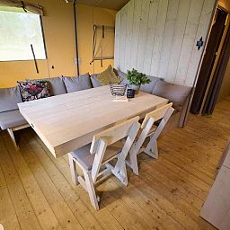 Spacious dining room in Safari Tent Wood, Biddinghuizen, ideal for a cozy meal in Flevoland.