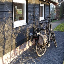 Bikes parked at Huisje in Haulerwijk, vacation home in the Frisian woods.
