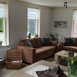 Cozy living room in Holiday home in Steggerda, surrounded by Frisian nature.