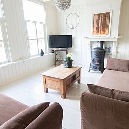 Cottage in Paesens, cozy living room with wood stove in the Frisian countryside.