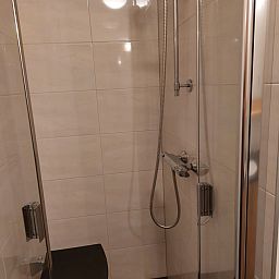 Cozy living room of vacation home FR440 in Friesland with comfortable sofa and natural light.