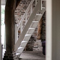 Relaxing bathroom experience at Holiday Home in Altforst, Gelderland with candles for a serene atmosphere.