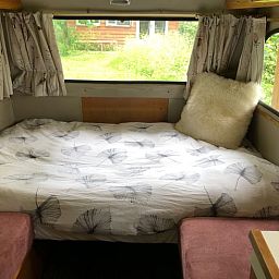 Cozy bedroom in Holiday home in Dreumel, located in the green River region of Gelderland, overlooking the garden.