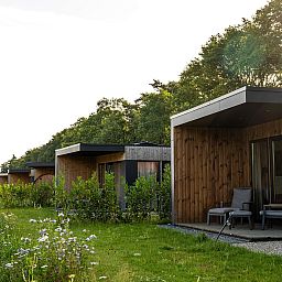 Cozy living room of Holiday Villa Amalia 2 in Kotten, overlooking nature.