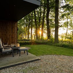 Enjoy the serenity of nature on the terrace of Holiday Villa Boslodge 2, located in picturesque Kotten, Achterhoek, Gelderland.