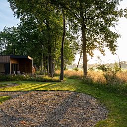 Rustic charm at Holiday Villa Boslodge 2 in Kotten, Achterhoek, overlooking lush nature and serene surroundings.
