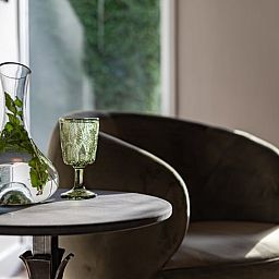 Cozy interior of cottage in Halle, Achterhoek, with tea set and book, ideal vacation home in Gelderland for relaxation.