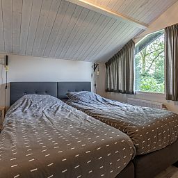 Buitenzijde van vakantiehuis DG994 in Aalten, Achterhoek, met bakstenen gevel.