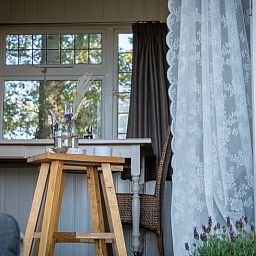 Cozy indoor area with wooden furniture in Holiday home in Vragender, Achterhoek, Gelderland. Atmospheric and cozy.