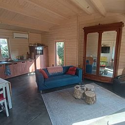 Cozy living room in cottage in Lochem with comfortable seating area in Gelderland.