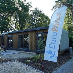 Veranda of Chalet in Lochem with garden furniture, located in the beautiful Achterhoek, Gelderland.