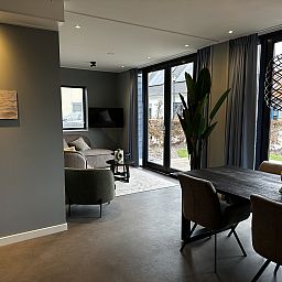 Dining area in Chalet in Lochem overlooking the nature of Achterhoek, Gelderland.