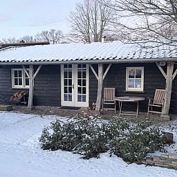 Holiday home in Hengelo Gld in the snowy countryside of Gelderland, with a cozy porch and winter charm in the Achterhoek region.