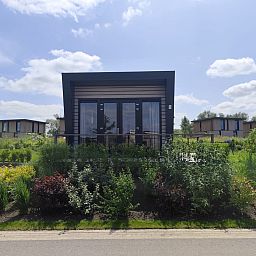 Detached house in Olburgen, a vacation home in Achterhoek, Gelderland, surrounded by green nature and a sunny garden.