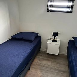 Sfeervolle slaapkamer in Vrijstaande woning in Olburgen, Achterhoek, Gelderland. Comfortabele bedden voor een ontspannen verblijf.
