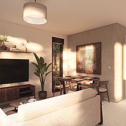 Gezellige woonkamer met eethoek in Chalet in Olburgen, ideaal vakantiehuis in Gelderland.