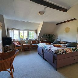 Spacious bedroom in Cottage in Warnsveld, Achterhoek, with comfortable double bed.