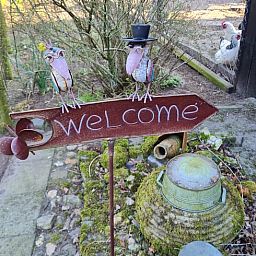 Welcome sign at Holiday Home in Winterswijk Corle, an inviting vacation home in the Achterhoek.