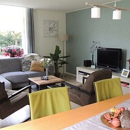 Cozy living room in Holiday Home in Winterswijk Corle, Achterhoek, Gelderland, with comfortable seating area and modern furnishings.