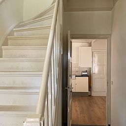Staircase of Holiday Home in Corle, Winterswijk Corle, overlooking kitchen, ideal for a relaxing stay.