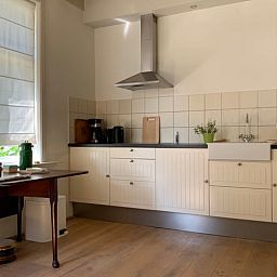 Modern kitchen in Holiday home in Corle, Winterswijk Corle, with lots of light and wooden floor, Achterhoek, Gelderland.