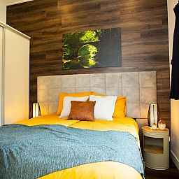 Bedroom in Beekhoeve 4 persons Wellness, Beekbergen, Veluwe, vacation home with comfortable furnishings.