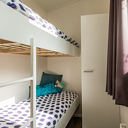 Sfeervolle slaapkamer met stapelbed in Rialto 6 personen Wellness vakantiehuis, Beekbergen, Veluwe, omgeven door rustgevende natuur.