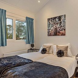 Bedroom with double bed in Ferox 5 persons Wellness vacation home in Ede, Veluwe.