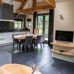 Modern kitchen and dining area in Cottage in Ermelo, vacation home in Veluwe, Gelderland with open layout.