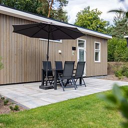 Terrace of detached house in Hoenderloo, Veluwe, with comfortable seating.