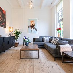 Stylish living room of Holiday Home in 't Harde, Veluwe, Gelderland with modern decor and lots of natural light.
