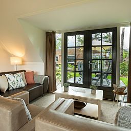 Comfortable sitting area in Holiday home Sprielderbosch 12 'De Kuifmees', ideal vacation home in the Veluwe, Putten.
