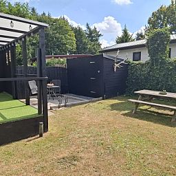 Enjoy the peace and quiet on the terrace of Chalet Relax in Putten, Veluwe. Perfect vacation home for nature lovers in Gelderland.