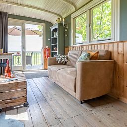 Cozy living room in Holiday Home in Wezep/Oldebroek, overlooking the Veluwe nature.