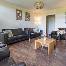 Cozy living room of Holiday home in Wezep Oldebroek, Veluwe, Gelderland with comfortable seating area.