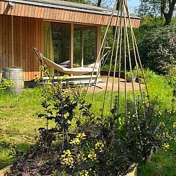 Nature views and wooden cottages from Huisje in Otterlo, located in Otterlo, Veluwe, Gelderland.