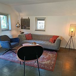 Gezellige zithoek in Vakantiehuis Geheim van Otterlo 6 in Otterlo, Veluwe, Gelderland voor ontspanning.