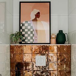 Modern bathroom in Holiday Home in Nunspeet, Veluwe, with stylish tile wall and artistic details.
