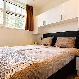 Tweede slaapkamer in Module special 6 personen Wellness Spa, vakantiehuis in Lunteren met luxe inrichting.