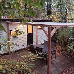 Cozy living room in Cottage in Hattemerbroek, Veluwe vacation home with comfortable seating area.