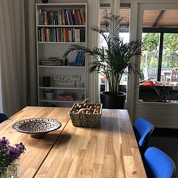 Cozy interior of Cottage in Wapenveld, Veluwe, Gelderland. Vacation home with stylish decor and views of the green garden.
