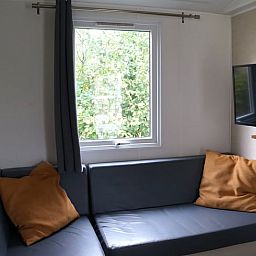 Gemuetliche Sitzecke mit TV in Haus in Lieren, Ferienhaus in der Veluwe in Gelderland.